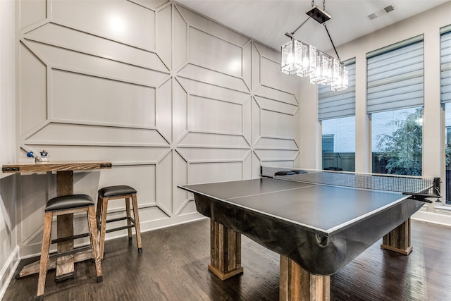 game room featuring dark wood-type flooring