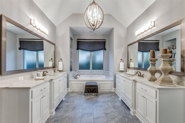 bathroom with backsplash, vanity, vaulted ceiling, a tub, and a chandelier