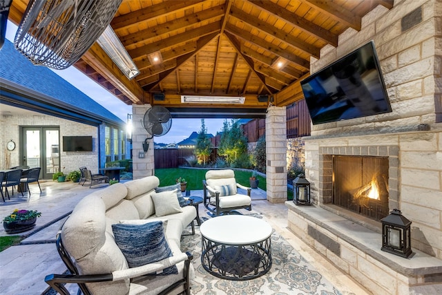 view of patio with a gazebo, french doors, and an outdoor living space with a fireplace