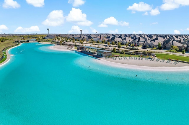 aerial view featuring a view of the beach and a water view