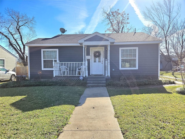 bungalow-style home with a front lawn