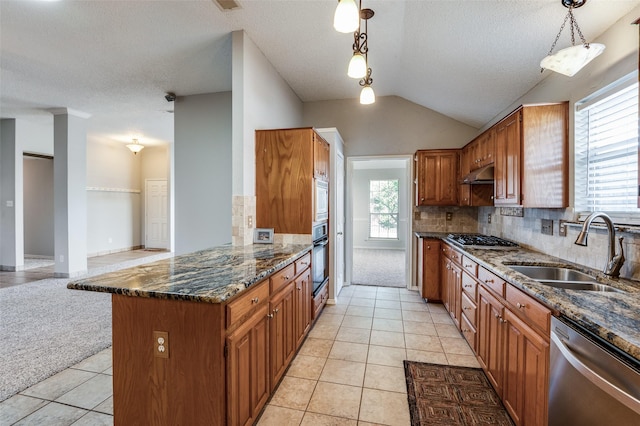 kitchen with pendant lighting, stainless steel appliances, a wealth of natural light, and sink