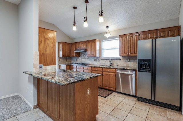 kitchen featuring kitchen peninsula, stainless steel appliances, vaulted ceiling, light tile patterned floors, and hanging light fixtures