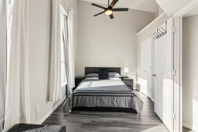 bedroom with lofted ceiling, hardwood / wood-style floors, and ceiling fan