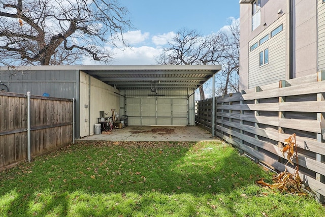 exterior space with a lawn and a carport