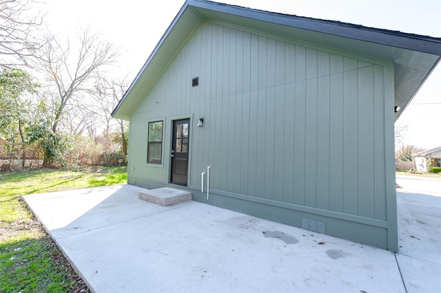 back of property with a patio