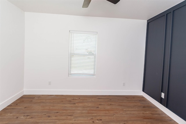 spare room with ceiling fan and hardwood / wood-style floors