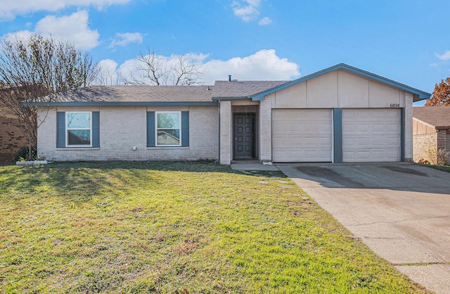 single story home with a garage and a front lawn