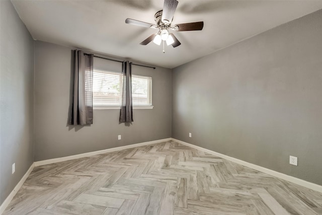 unfurnished room featuring ceiling fan and light parquet floors