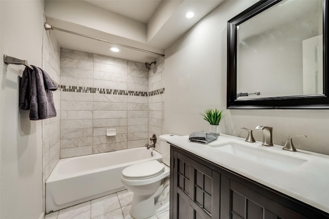 full bathroom with toilet, vanity, tiled shower / bath, and tile patterned flooring