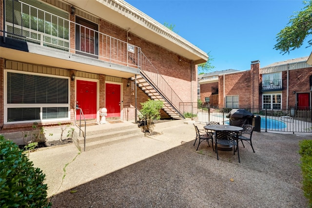 view of patio / terrace with a fenced in pool