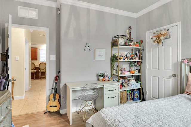 tiled bedroom featuring built in desk and crown molding