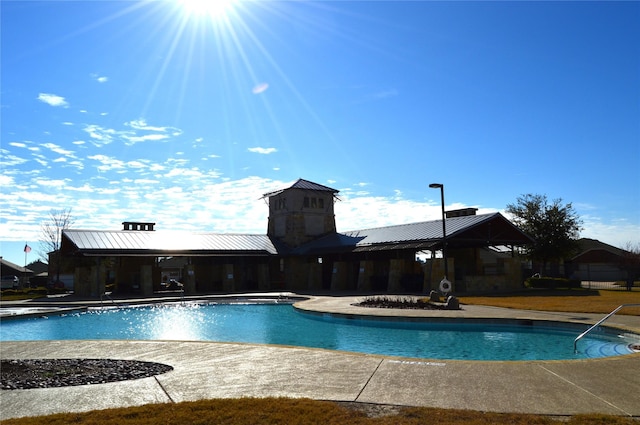 view of swimming pool with a patio