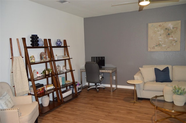 home office with ceiling fan and hardwood / wood-style flooring