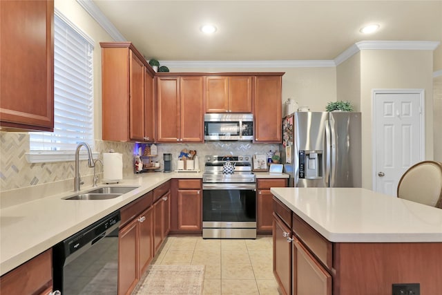 kitchen with decorative backsplash, appliances with stainless steel finishes, crown molding, and sink