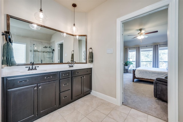 bathroom featuring tile patterned floors, ceiling fan, plenty of natural light, and an enclosed shower