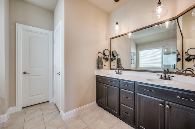 bathroom featuring tile patterned flooring and vanity