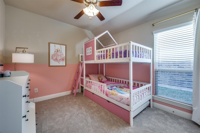 bedroom featuring ceiling fan and light carpet