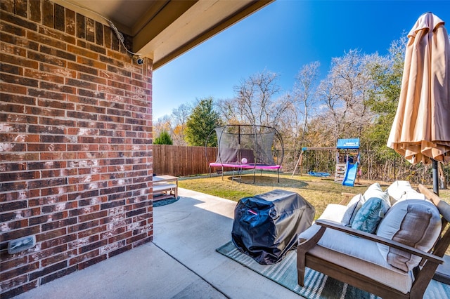 view of patio / terrace featuring a playground, an outdoor living space, and a trampoline