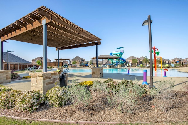 surrounding community featuring a pergola, a patio area, and a swimming pool