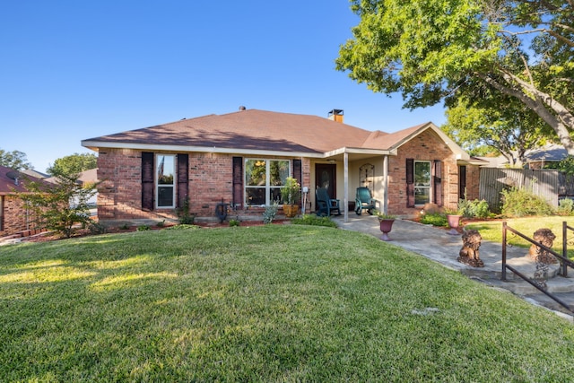 ranch-style home with a patio area and a front lawn