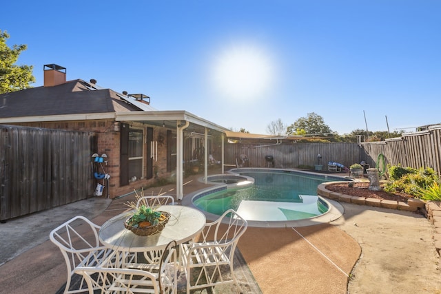 view of swimming pool with a patio