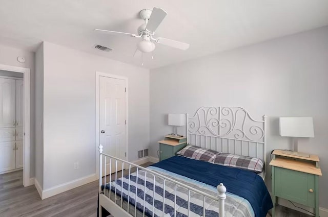 bedroom featuring ceiling fan and hardwood / wood-style flooring