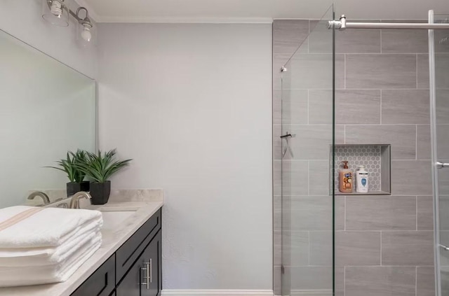 bathroom with vanity and a shower with shower door