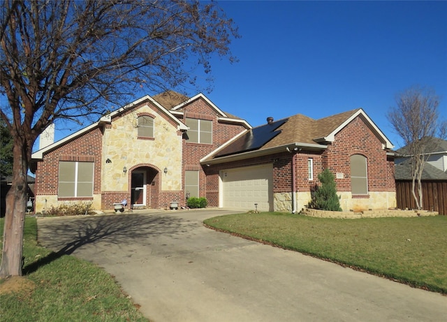 view of front facade with a front lawn and a garage