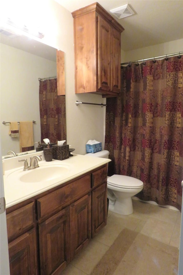 full bath featuring toilet, visible vents, and vanity