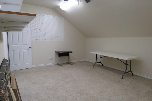 bonus room featuring lofted ceiling, light colored carpet, and ceiling fan