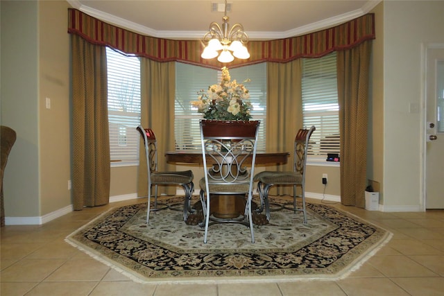 tiled dining space with ornamental molding, visible vents, an inviting chandelier, and baseboards