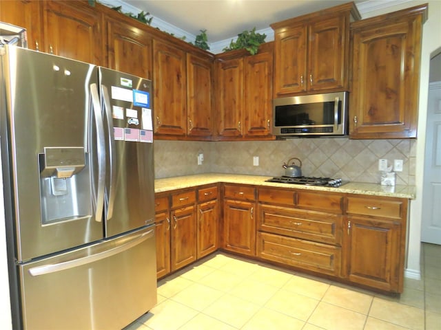 313 Hidden Lake Ct, Burleson, TX 76028 - kitchen with stainless steel appliances, backsplash, and light stone counters
