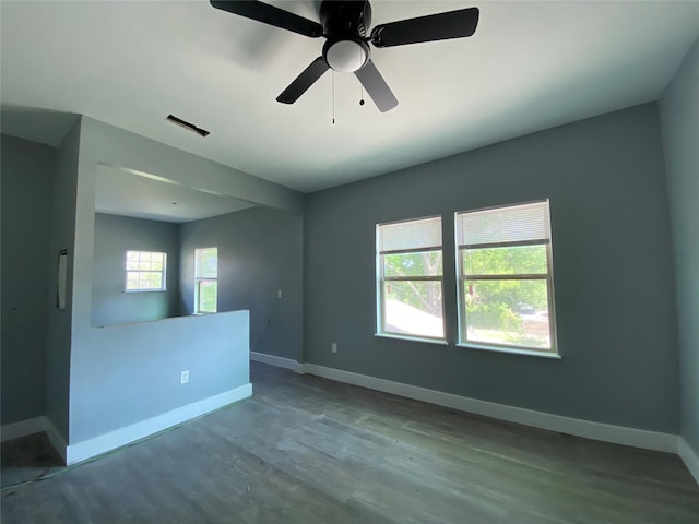 empty room with hardwood / wood-style flooring and ceiling fan