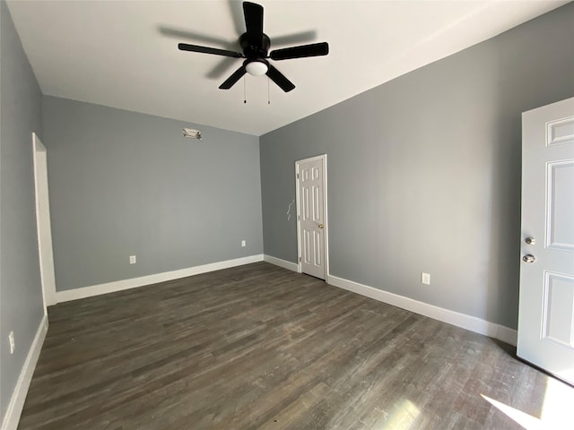 unfurnished room featuring dark hardwood / wood-style floors and ceiling fan