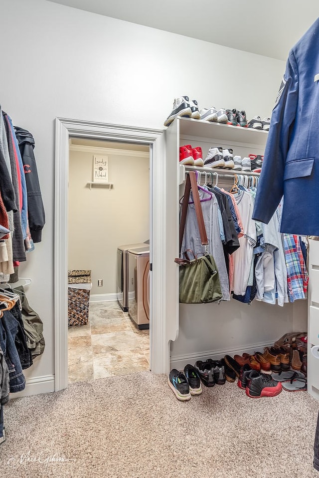 spacious closet featuring washing machine and dryer