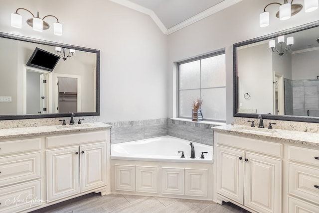 bathroom featuring crown molding, vanity, lofted ceiling, and shower with separate bathtub