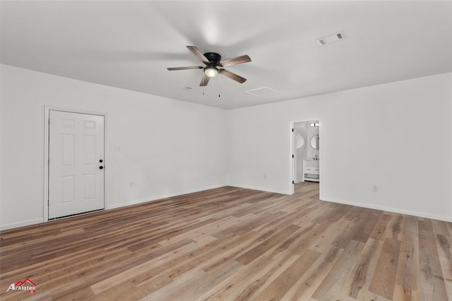 unfurnished living room featuring ceiling fan and light hardwood / wood-style floors