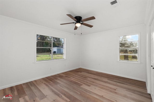 unfurnished room with ceiling fan, ornamental molding, and light wood-type flooring