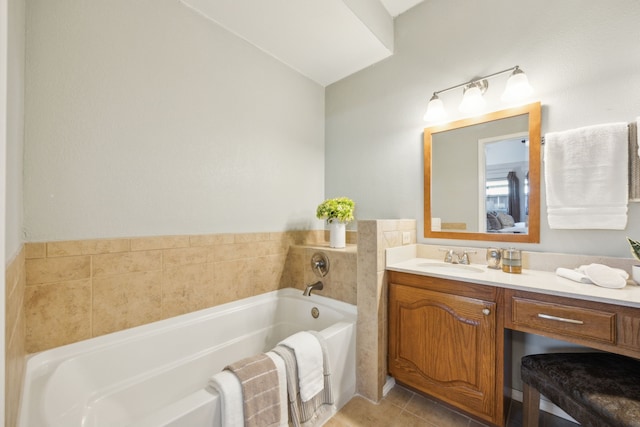 bathroom with tile patterned flooring, vanity, and a washtub