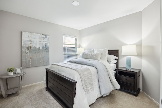 bedroom with light colored carpet