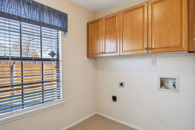 clothes washing area with cabinets, hookup for a washing machine, light tile patterned floors, and hookup for an electric dryer