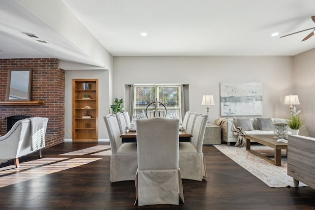 dining room with ceiling fan, dark hardwood / wood-style flooring, and built in features