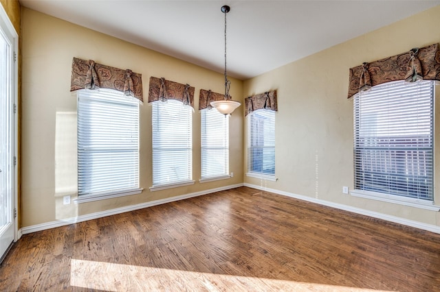 unfurnished dining area with hardwood / wood-style floors