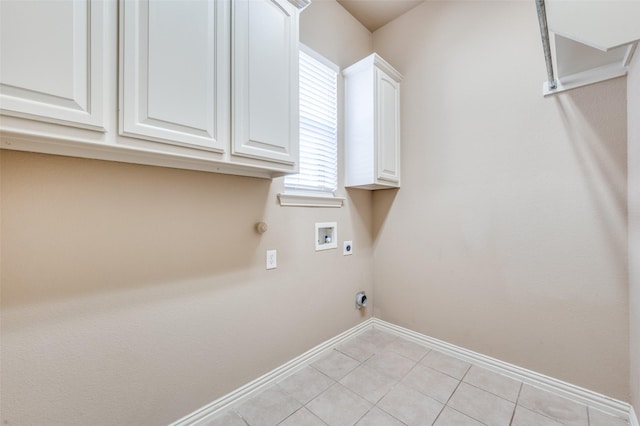 laundry area with hookup for an electric dryer, hookup for a washing machine, cabinets, gas dryer hookup, and light tile patterned floors