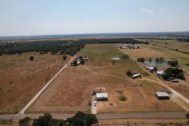 bird's eye view featuring a rural view and a water view