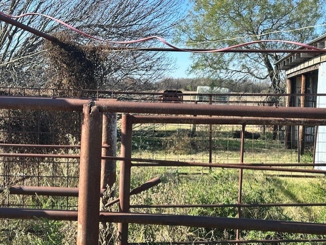 view of gate featuring an outdoor structure