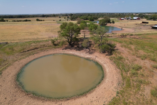 drone / aerial view featuring a water view and a rural view