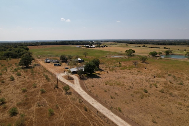 bird's eye view featuring a rural view and a water view