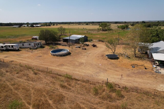 birds eye view of property with a rural view